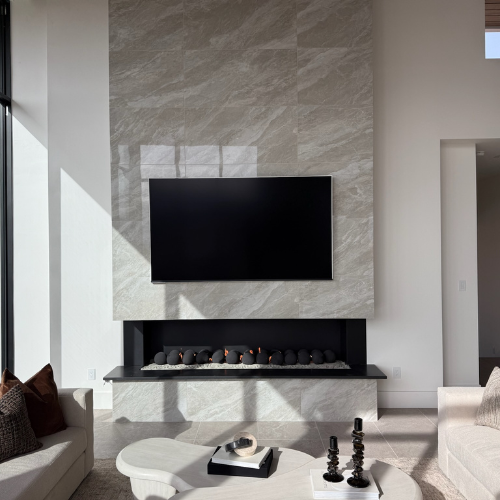 Custom Mason-Lite three-sided fireplace with black ceramic spheres